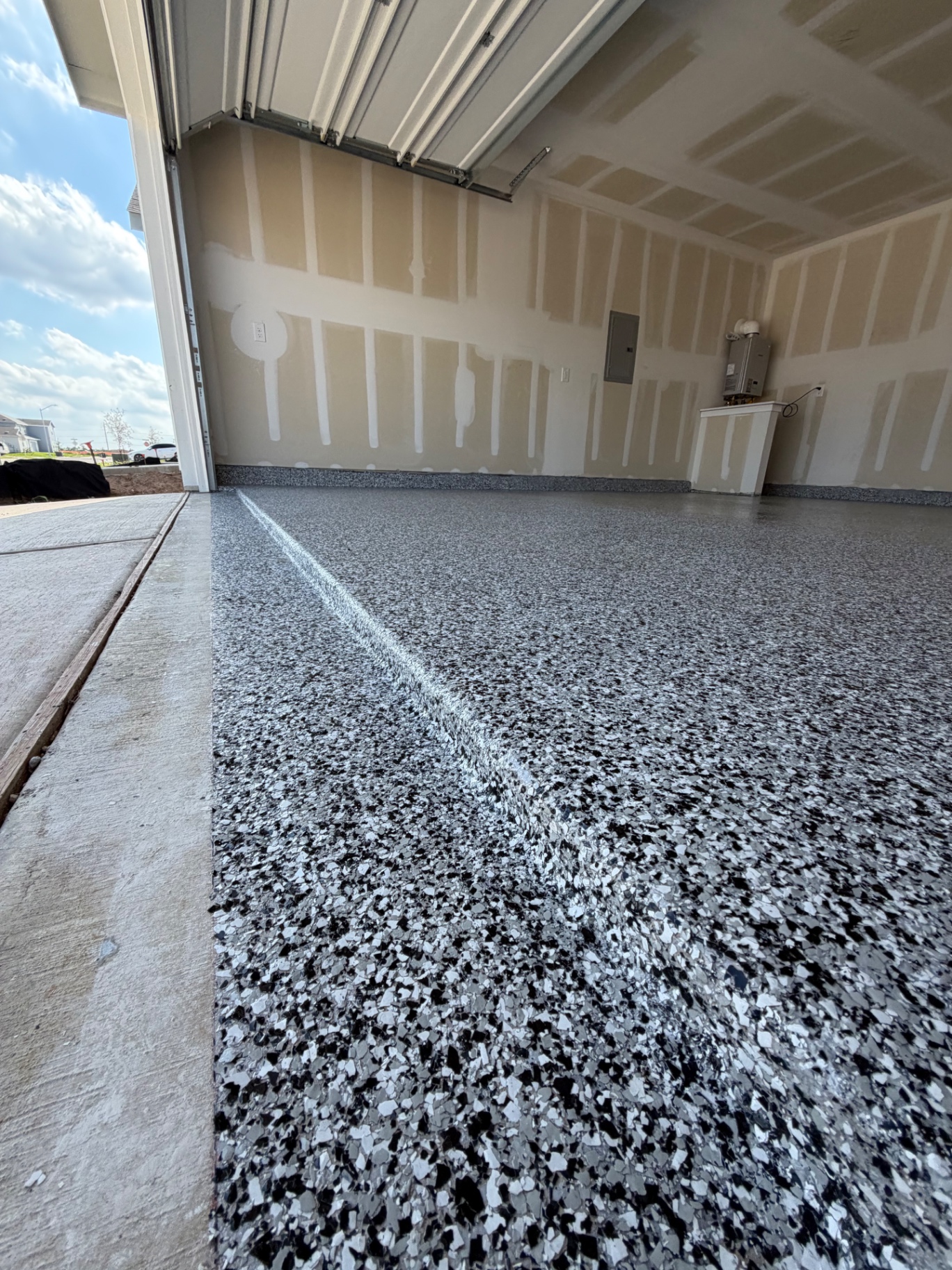 After: full-flake polyaspartic garage floor installed by Garage Transformers
