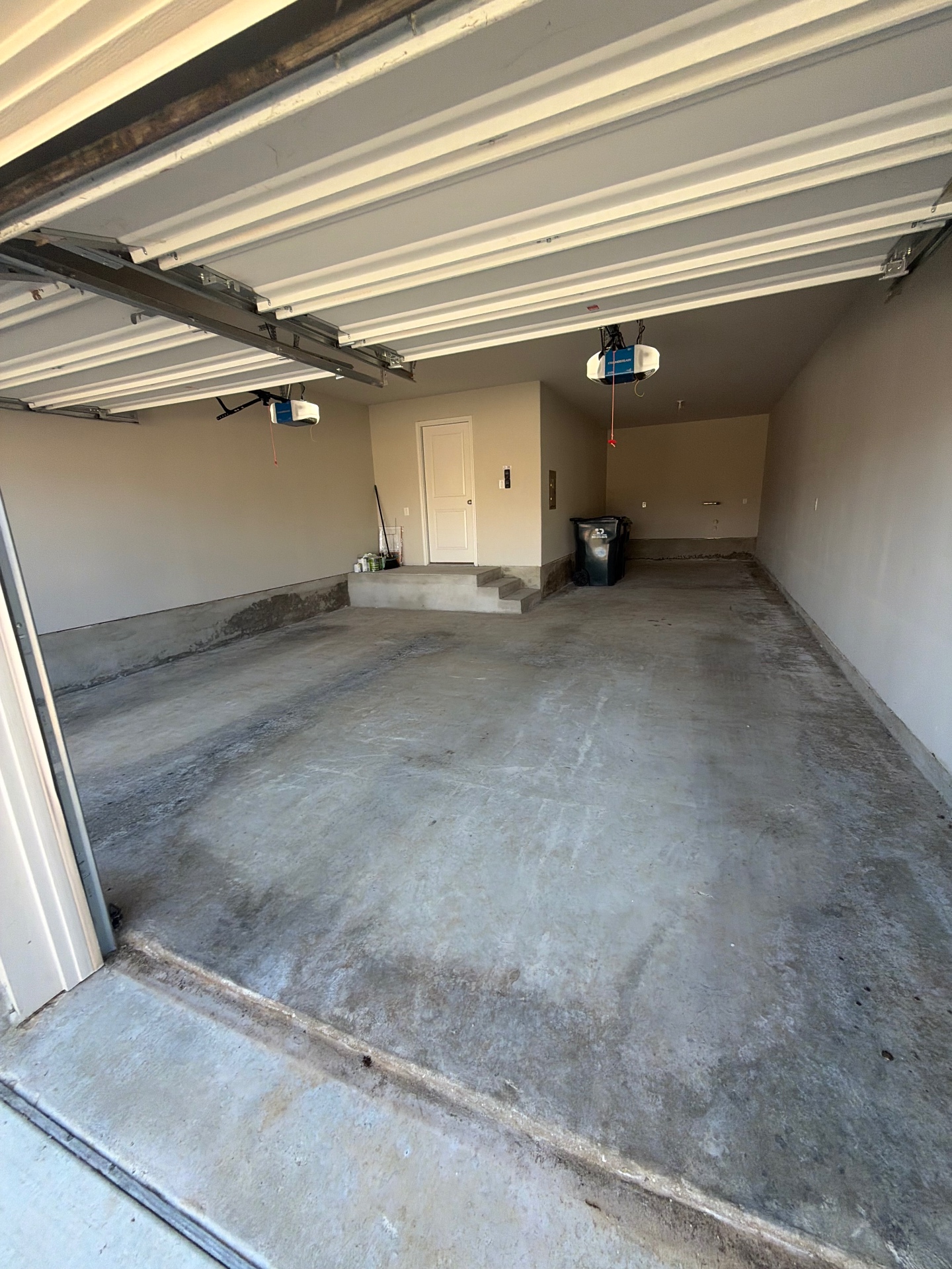 Before: bare concrete garage floor